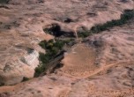 Lake Pagahrit -- Aerial view of the site of Lake Pagahrit. The sandy area in the center of the image is the site of the natural dam that formed the lake. Lamont Crabtree Photo